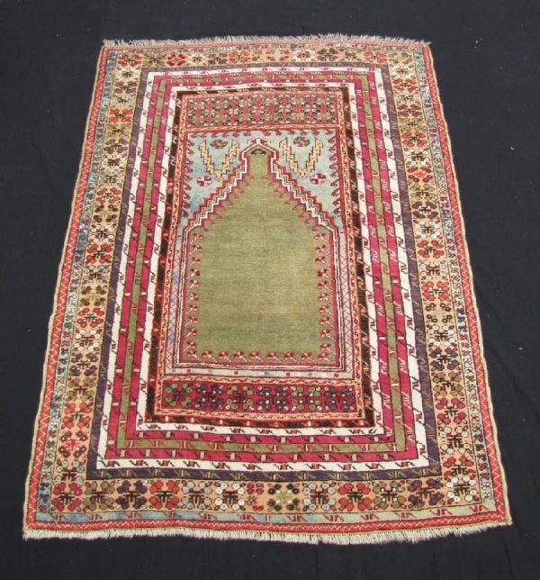 78 Lot 78, a Kirshehir Prayer Rug, Turkey circa 1800, 179 cm x 127 cm.