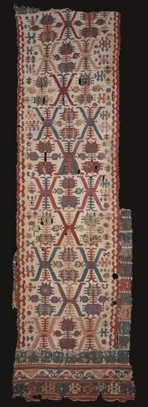 Kilim, 18th century  Turkey, Anatolia  Wool, cotton; slit tapestry weave, eccentric curved wefts  121.9 x 388.6 cm.