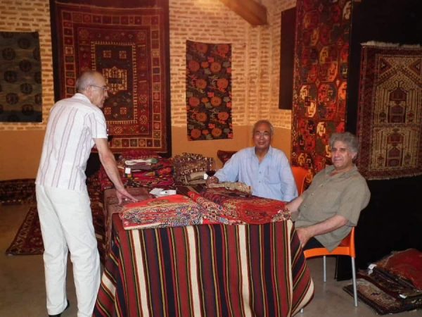 Bertram Frauenknecht, Mohammad Zavvar and Mohammad Tehrani in the stand of Tehrani Antique & Contemporary Textile Art.