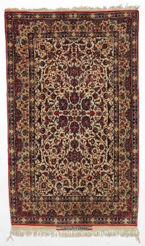 isfahan Signed Seirafian rug, Persia. Medallion design on an ivory field. Knotted with kork wool on silk warps. C. 1 mio. kn. pr. sqm. Signed: Seirafian Isfahan Iran. Mid 20th century. 170 x 102 cm. Est. 1500.- Euro
