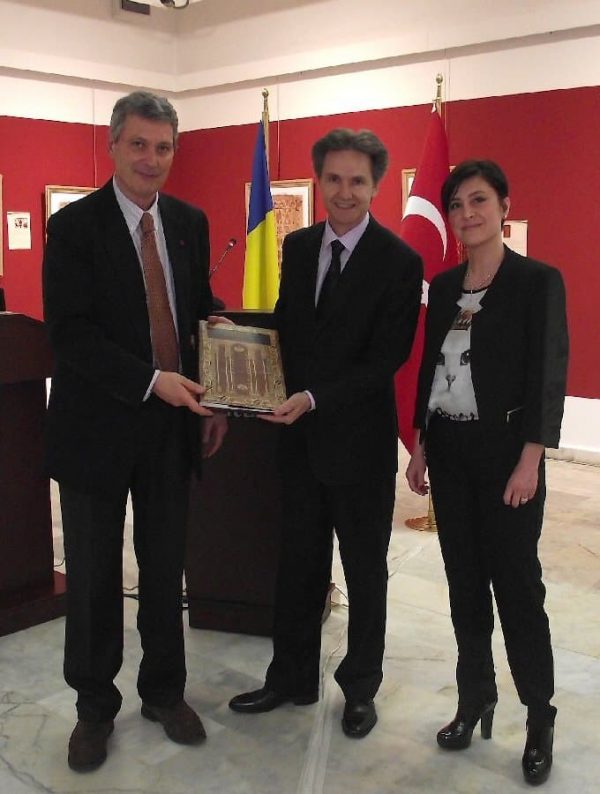 4 Amb. Radu Onofrei receiving Stefano Ionescu's book on Transylvanian carpets The Romanian ambassador
