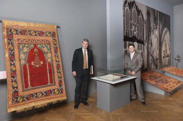 Stefano Ionescu and Adrian Luca (curator of the Oriental carpet collection, Brukenthal Museum) near a copy of Schmutzler's book