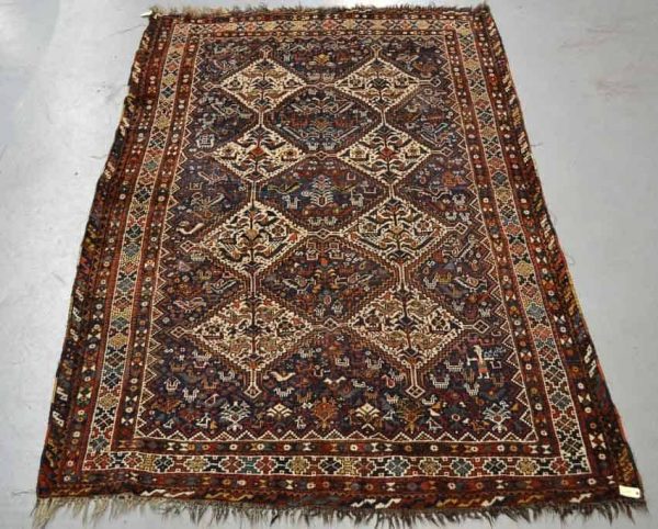 Lot 1654, a carpet by the Arab Ghani tribe of the Khamseh Confederation, Fars, south west Persia, early 20th century, 10ft. x 6ft. 10in. 3.05m. x 2.08m. Estimate: £400-600