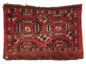 Lot 139. Large Turkoman Chuval-face, Central Asia, 18th century, with extensive silk and cotton highlights, 3 ft. 6 in. x 5 ft. 7 in. Provenance: The Ronnie Newman Collection of Early Rugs. Estimate $1,200 - $1,500