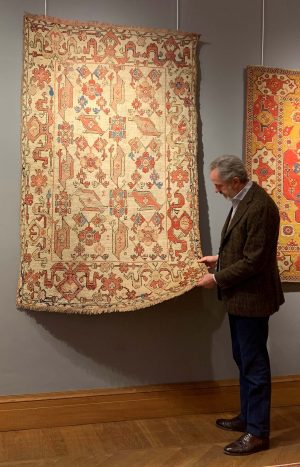 Mirco Cattai in front of a 17th century Ushak Selendi 'Bird' rug