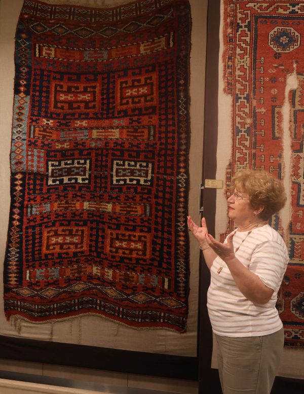 Dr. Suzan Bayraktaroglu shows the study group an 19th century East Anatolian rug