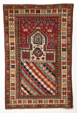A RARE GENDJE PRAYER RUG DATED AH 1278/1861 AD